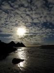 FZ010219 Three Cliffs Bay hole in rocks and river over beach.jpg